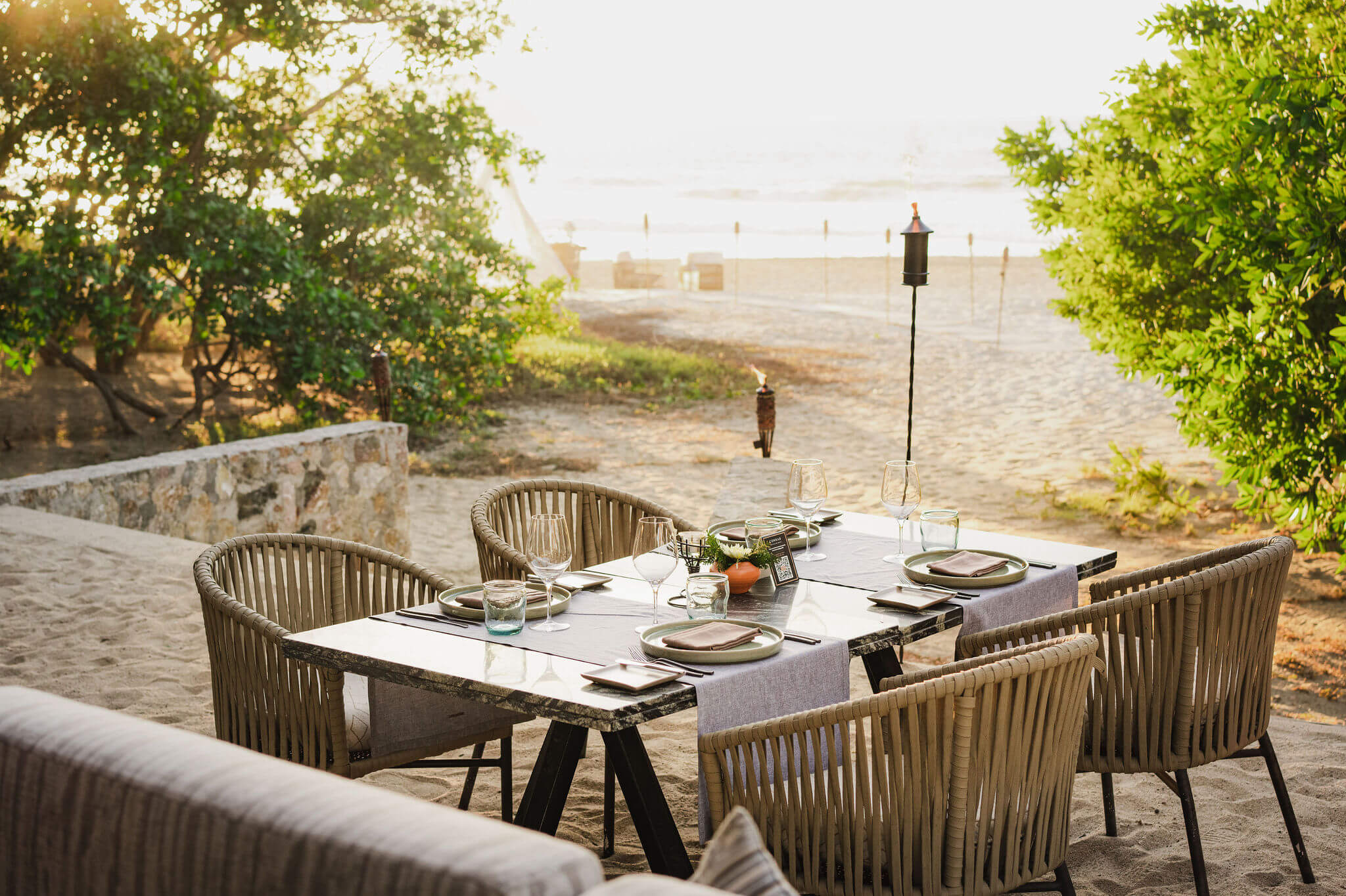 Picture of the dining table on the beach with the sea view