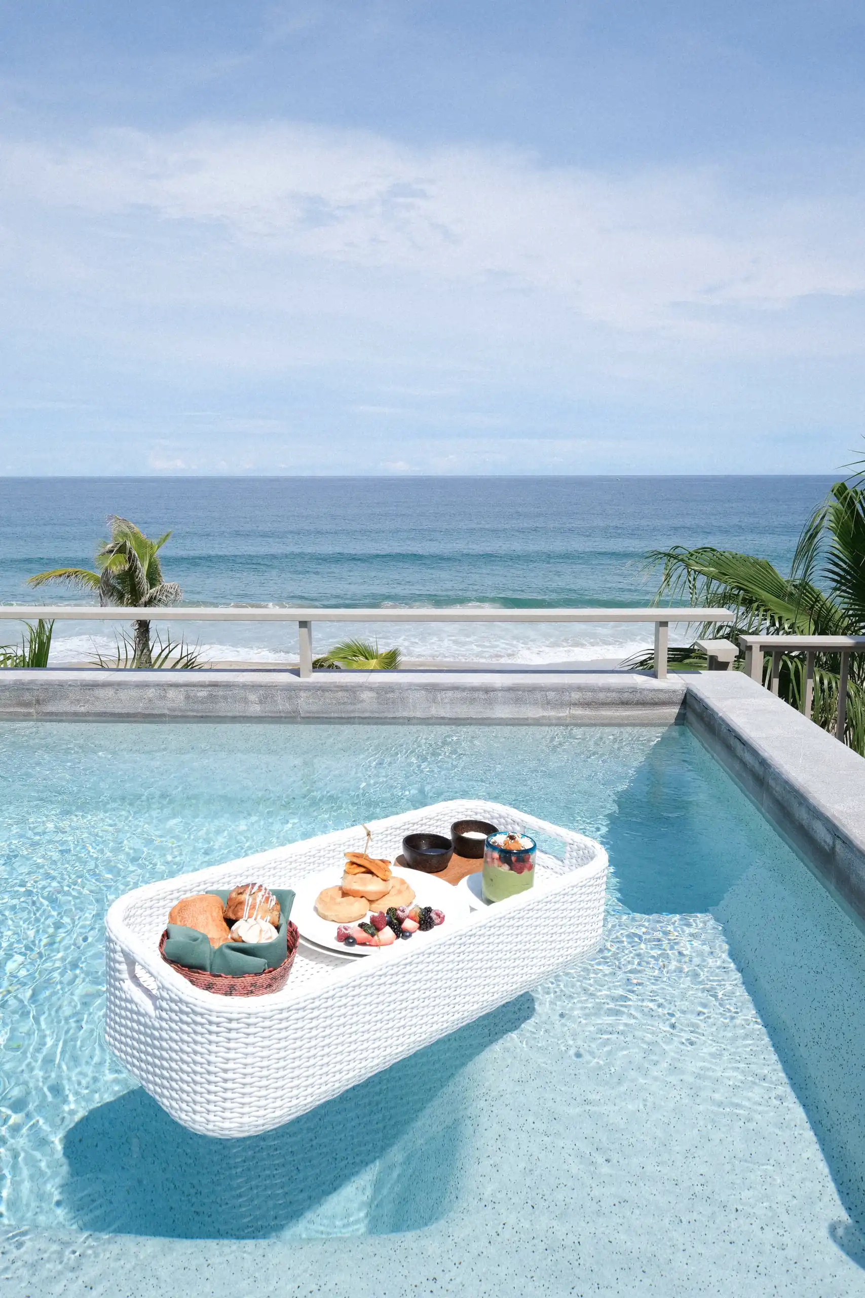Picture of table with food in the swimming pool