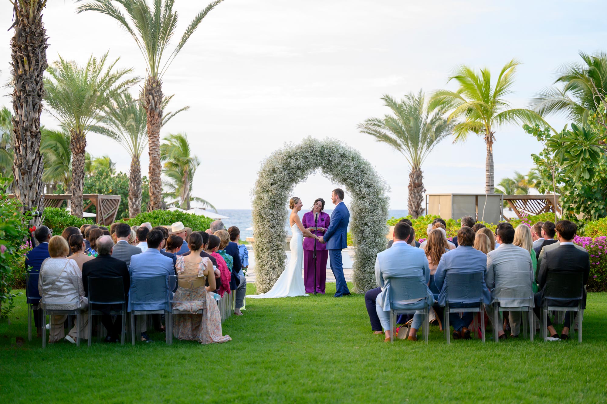 People are witnessing the wedding ceremony of the couple with joy and celebration.