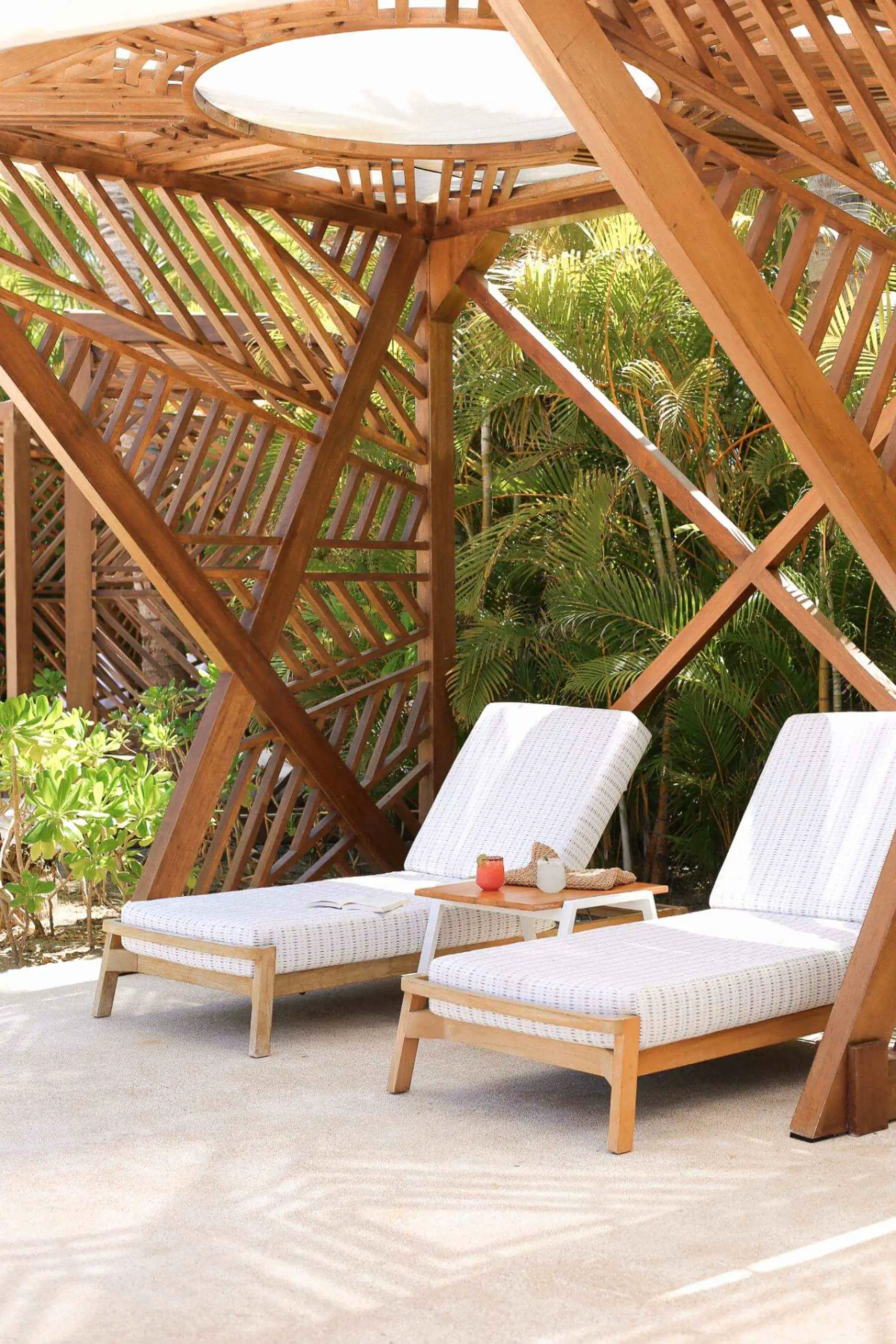 Idyllic private cabanas with white loungers
