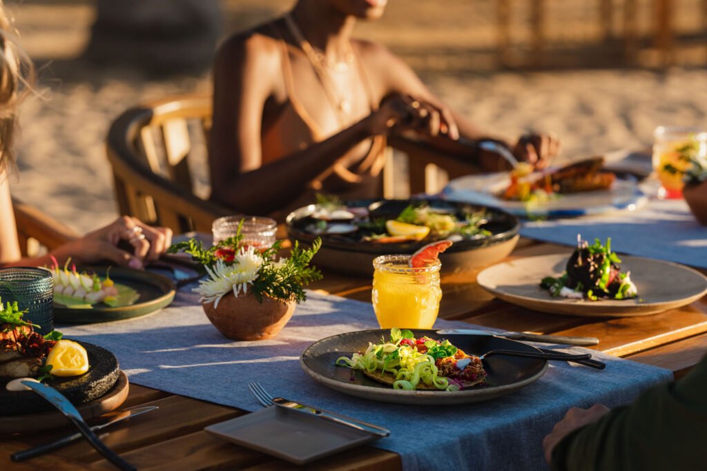 Various breakfasts on the table, ladies immersed in savoring their meals.