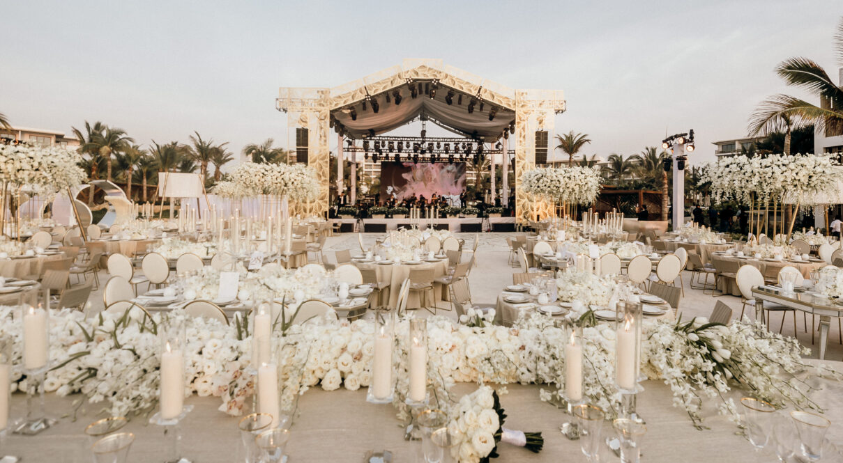 The wedding lawn adorned with white flowers, creating a magical wedding ambiance.