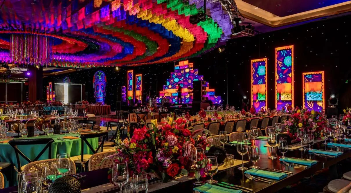 A large room is elegantly decorated with various lights and items for the celebration.