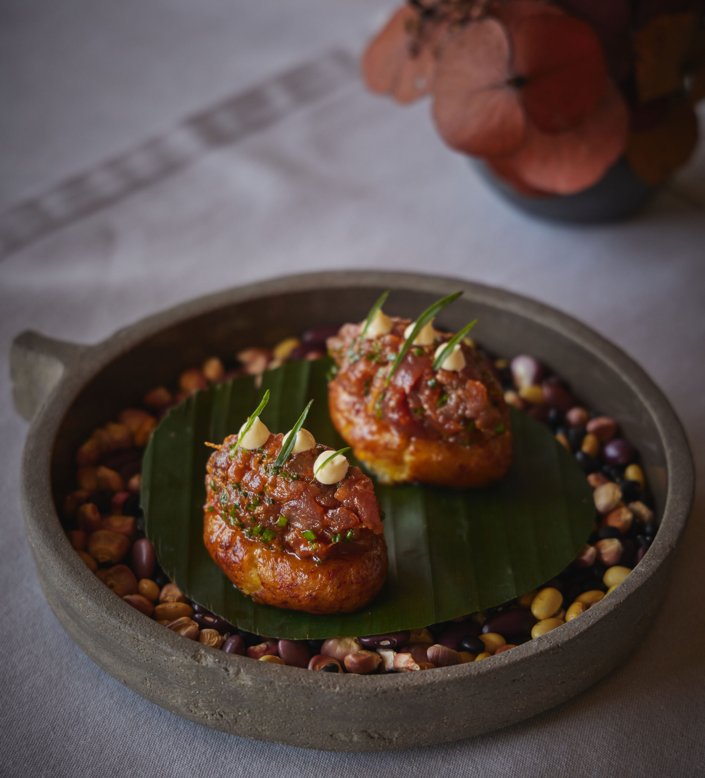 A photo shows a delicious breakfast served on a charcoal plate for presentation.